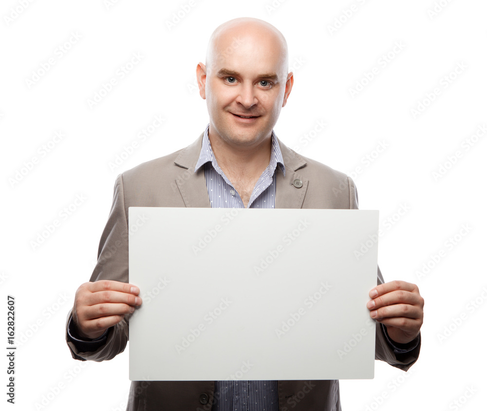 Happy bald man showing and displaying placard ready for your text or product Happy bald man showing and displaying placard ready for your text or product