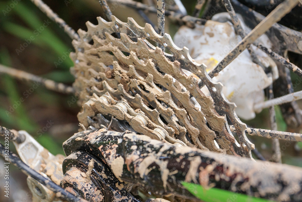 Dirty mountain bike covered with mud and dirt Dirty mountain bike covered with mud and dirt