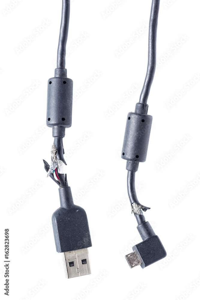 close up of broken smart phone usb charger cable on white background close up of broken smart phone usb charger cable on white background