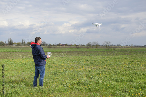A man with a remote control in his hands. Flight control of the drone. Phantom