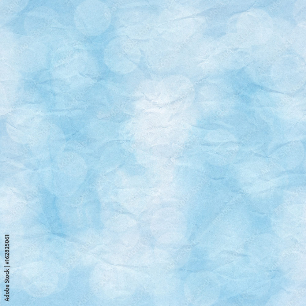 Bokeh light on blue crumpled paper Bokeh light on blue crumpled paper