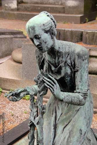 Woman Praying Sculpture in Milan Monumental cemetery