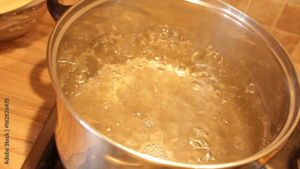 boiling water in a saucepan boiling water in a saucepan