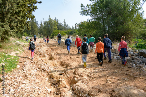 JERUSALEM - FEB. 11, 2017: Group of Isaraeli fourth grade school kids and their parents on a field trip in a forest near Jerulaem