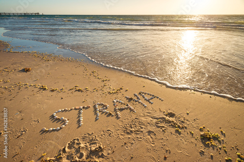Straya text on beach