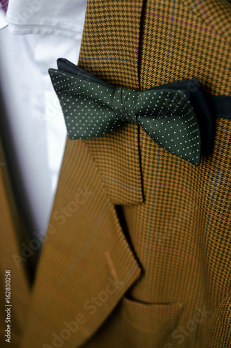 Jacket with a bow tie