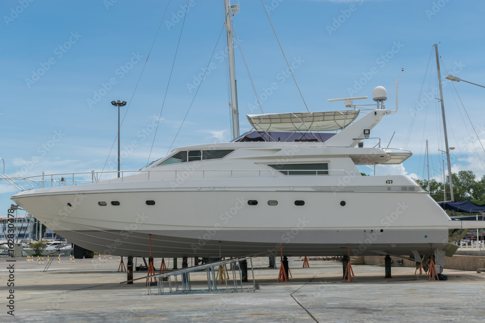 Motor Yacht waiting for repair on the shipyard in Phuket ,Thailand