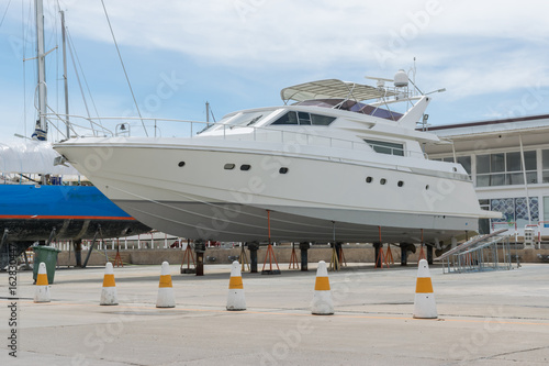 Luxury motor yacht waiting for repair on the shipyard in Phuket ,Thailand