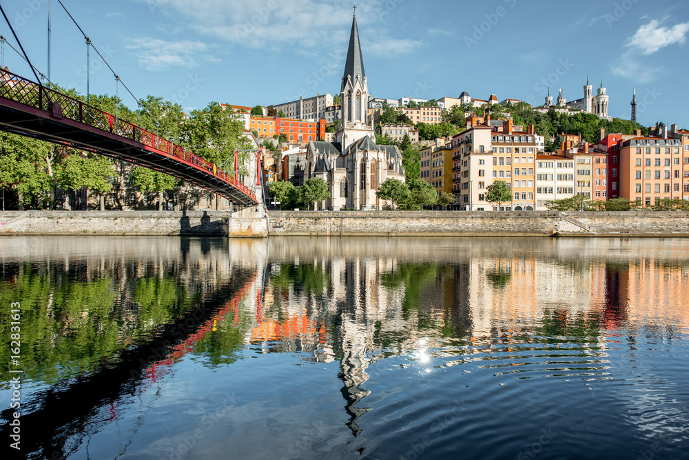 Morning view on the riverside with saint George cathedral and footbridge in the old town of Lyon city