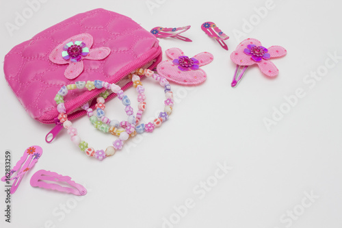 Hair pink accessories for girls, teenagers. Hair pins and clips, necklaces. Fashion hair style accessories and Cosmetic bag, beautician.