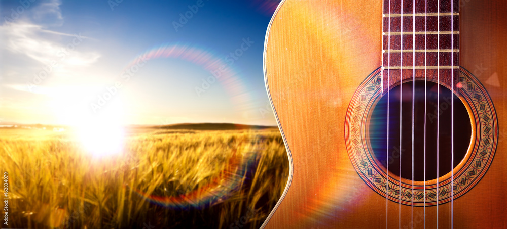 Fondo musical con guitarra española y paisaje de atardecer. Cultura  española y tradiciones foto de Stock | Adobe Stock