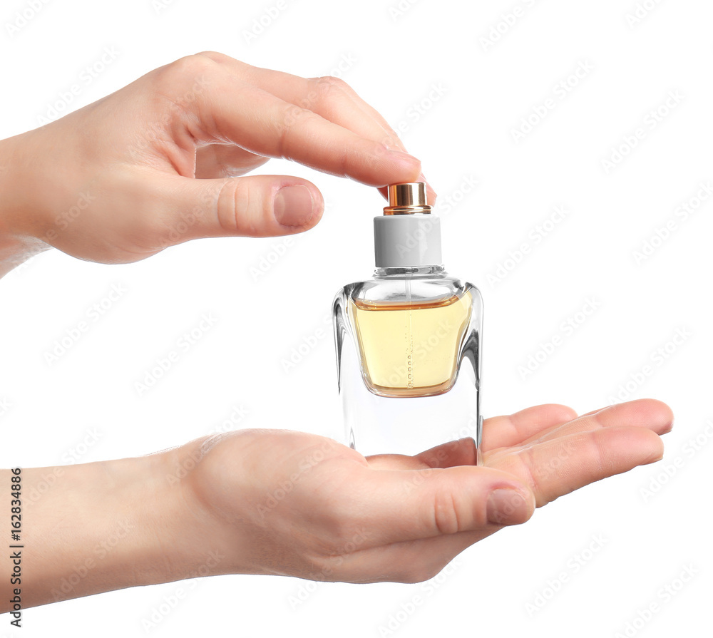 Female hands holding perfume bottle on white background foto de Stock |  Adobe Stock