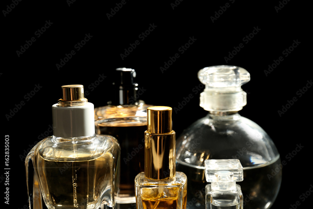 Perfume bottles on black background Perfume bottles on black background
