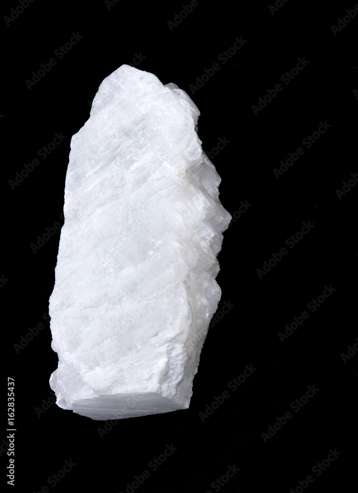 White mexican fish tail selenite on black background White mexican fish tail selenite on black background