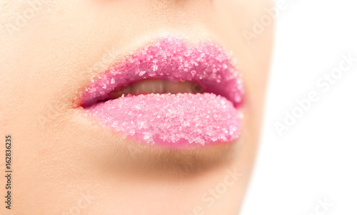 Woman with sugar lips on white background, closeup
