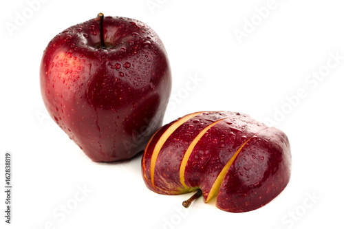 slices of juicy red apple on a white background