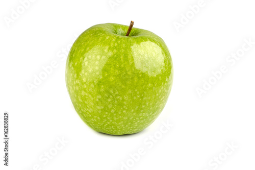 one ripe juicy green apple on a white background