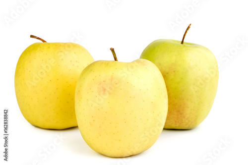 ripe yellow apples on a white background