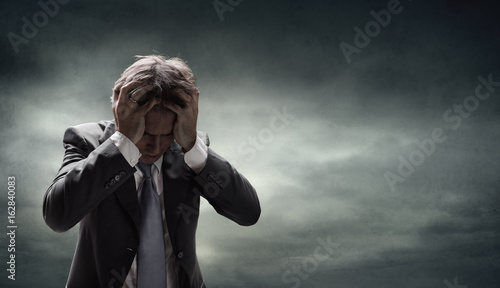 Obraz na plátně Depressed Businessman With Grunge Cloudscape