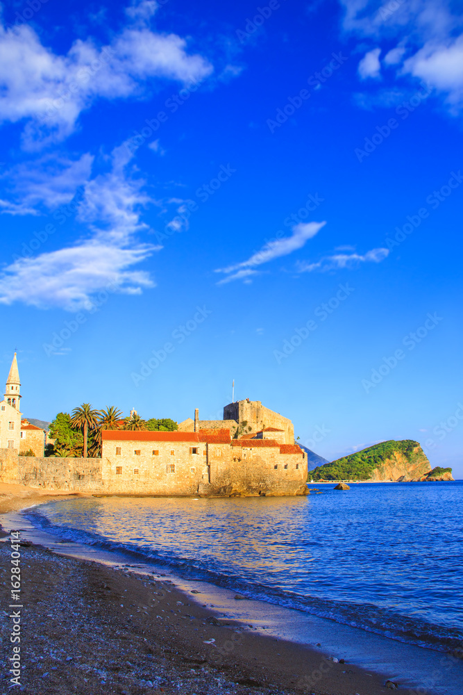 BUDVA, MONTENEGRO - JULY 10: Beautiful view of the old town of Budva and the bell tower of the Church of St. John on July 10, 2016 in Budva.
