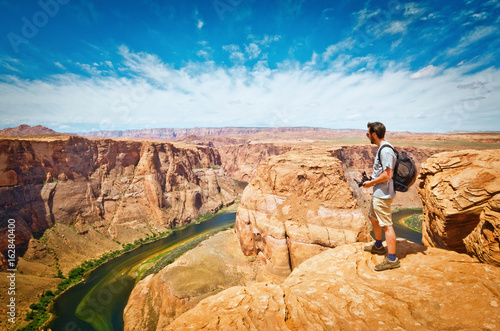 man look at Horseshoe Bend at Utah. USA