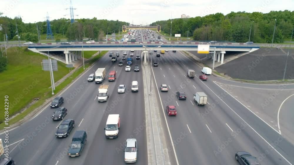 Heavy traffic at road bridge above highway. Heavy traffic at road bridge above highway.