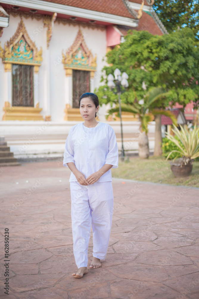 Buddhist Nuns meditation walking in the temple of thailand. Buddhist Nuns meditation walking in the temple of thailand.