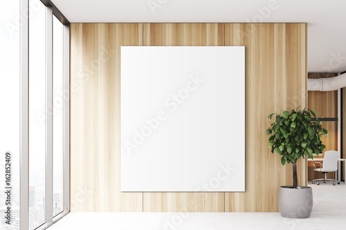 Blank poster in a wooden office