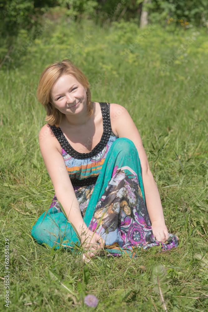 Fototapeta premium Smiling girl in summer