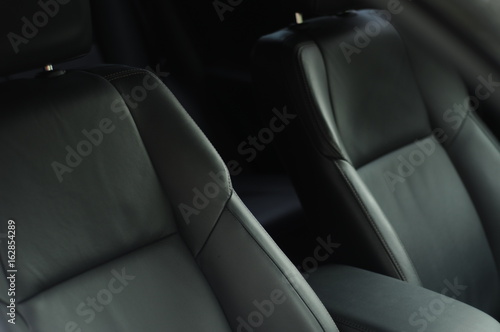 New car interior passenger driver seats leather details
