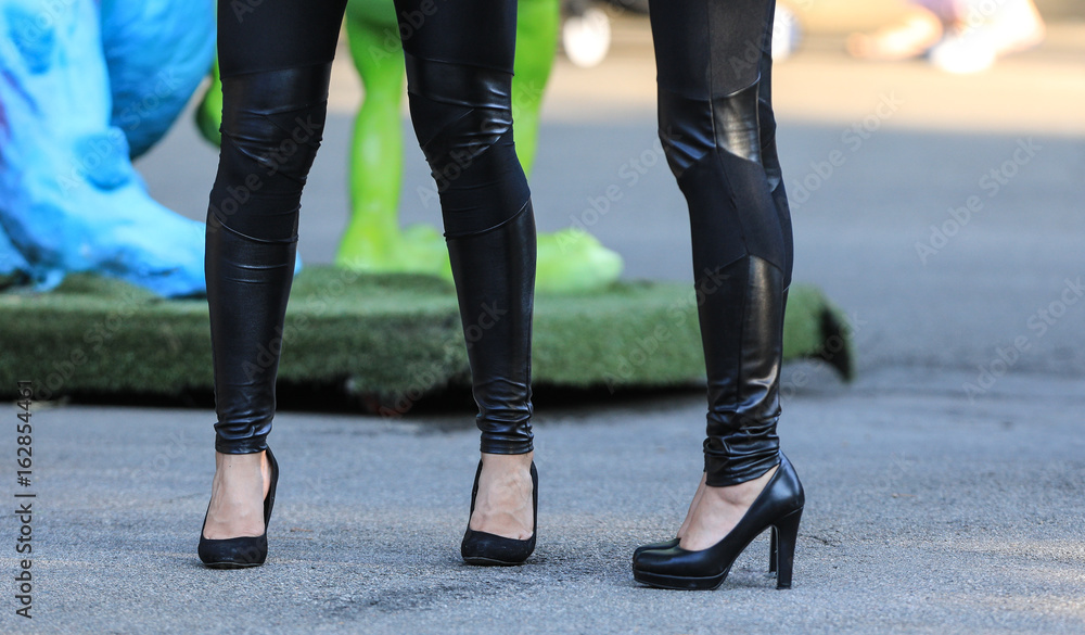 Legs girls in shoes and black pantyhose Legs girls in shoes and black pantyhose