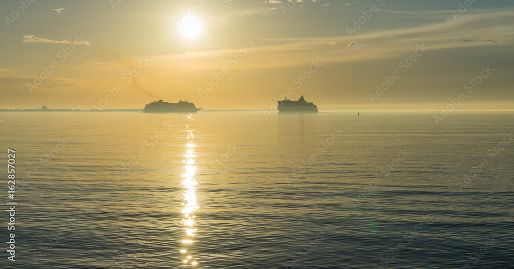 Sunset and cruise ship on the sea