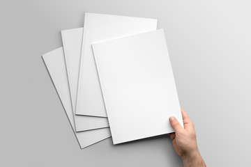Blank A4 photorealistic brochure mockup on light grey background. 