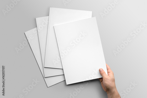 Blank A4 photorealistic brochure mockup on light grey background.  photo