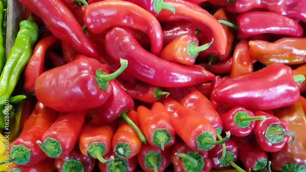 Fresh red peppers for sale in a market. Fresh red peppers for sale in a market.