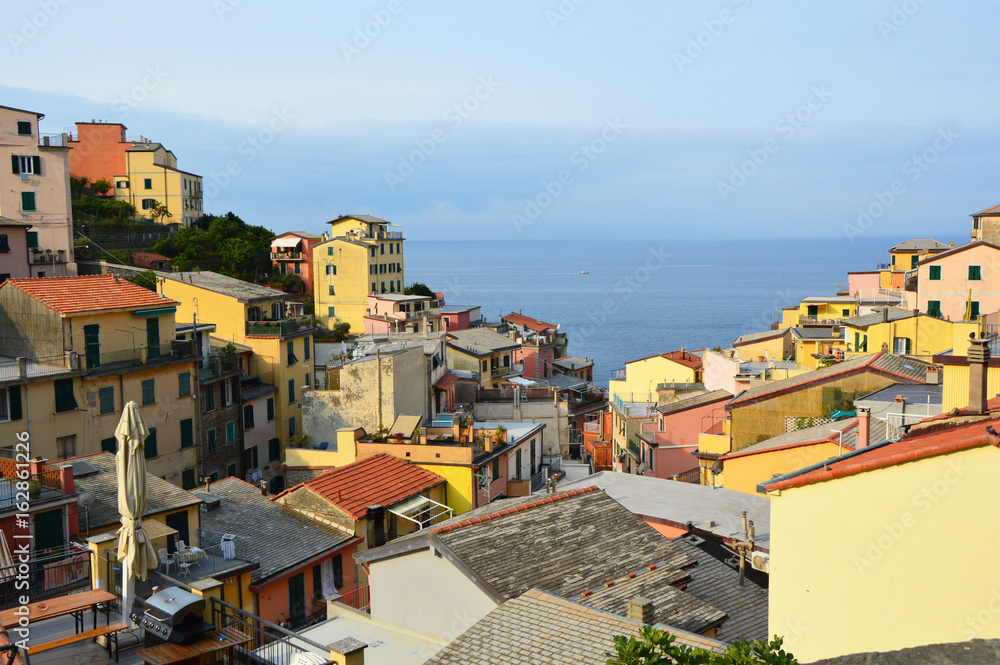 Panoramic view from the center of Riomaggiore with Mediterranean sea on the background, Riomaggiore, Cinque Terre, Italy