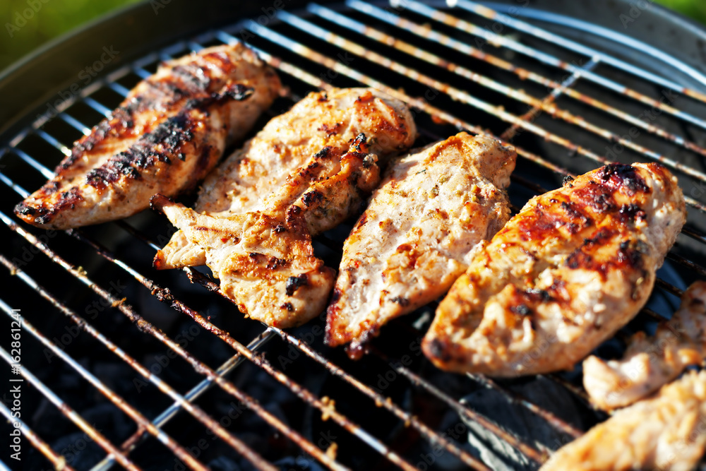 Grilled chicken breast on barbeque