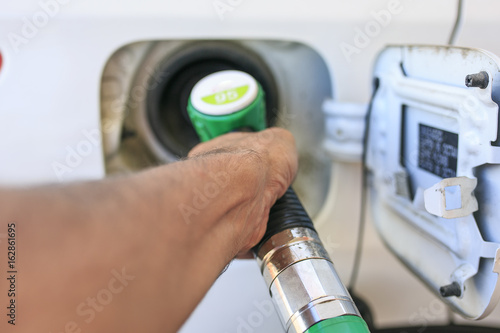 Man refilling his gasoline car