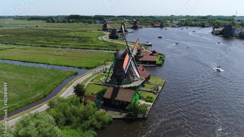 Wallpaper Mural Aerial bird-eye view of Zaanse Schans Zaandam flying past one of well-preserved historic windmills for tourists this is one of the most popular tourist attractions near Amsterdam Holland Netherlands Torontodigital.ca