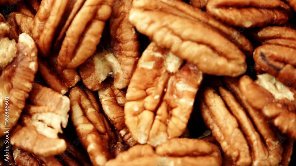 Food background. Pecan nuts close up. Dieting concept. Dolly slider shot rack focus 4K ProRes HQ codec Food background. Pecan nuts close up. Dieting concept. Dolly slider shot rack focus 4K ProRes HQ codec