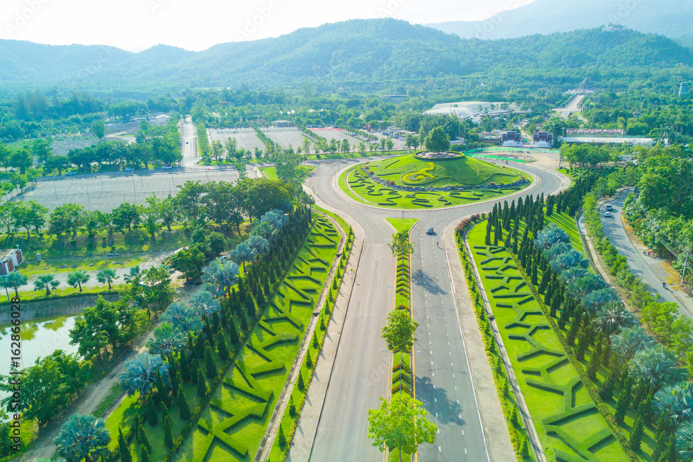 Aerial view of beautiful road at Royal Park Rajapruek  with beautiful green garden , Chiang Mai , Thailand