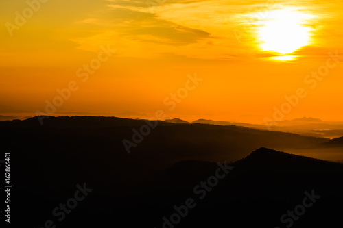 colorful sunrise in the mountain. Silhouette background.