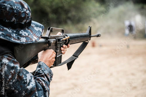 Thai soldier shooting rifles at firing range
