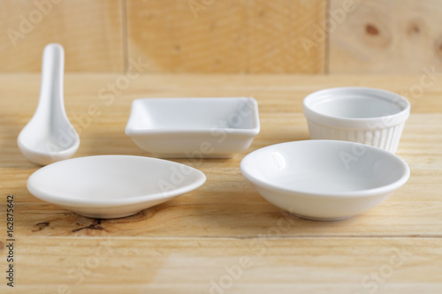 Fototapeta Naklejka Na Ścianę i Meble -  white ceramic ware on wooden table