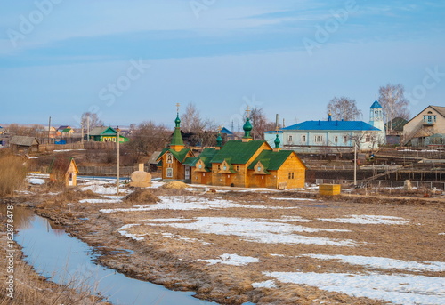 Wooden chapel on the holy spring in the village of Diveevo photo
