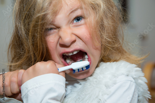 little funny girl with retainer and toothbrush