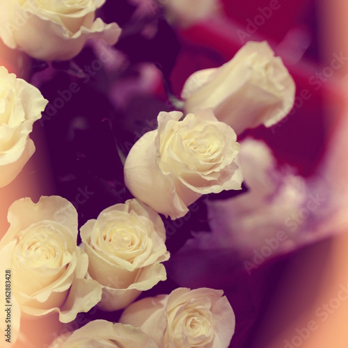 closeup of white roses bouquet, square format, old vintage photo effect