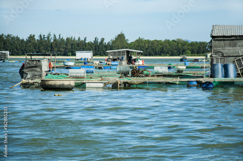 Marine fish farm in Vietnam. Floating houses.