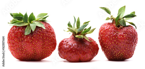 Imperfect organic sweet strawberries isolated