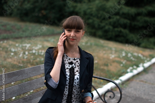 Beautiful business woman talking on the phone. photo